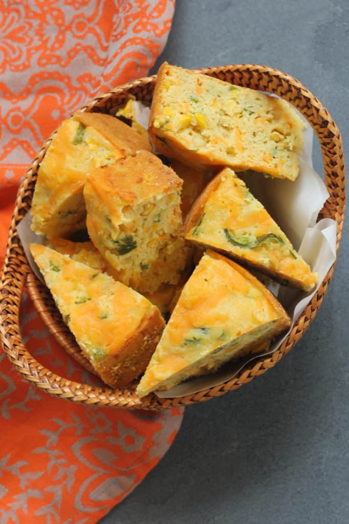 freshly baked Jalapeno Cheddar Cornbread in a small wicker basket