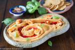 roasted sweet potato hummus served in a stone bowl with healthy toppings
