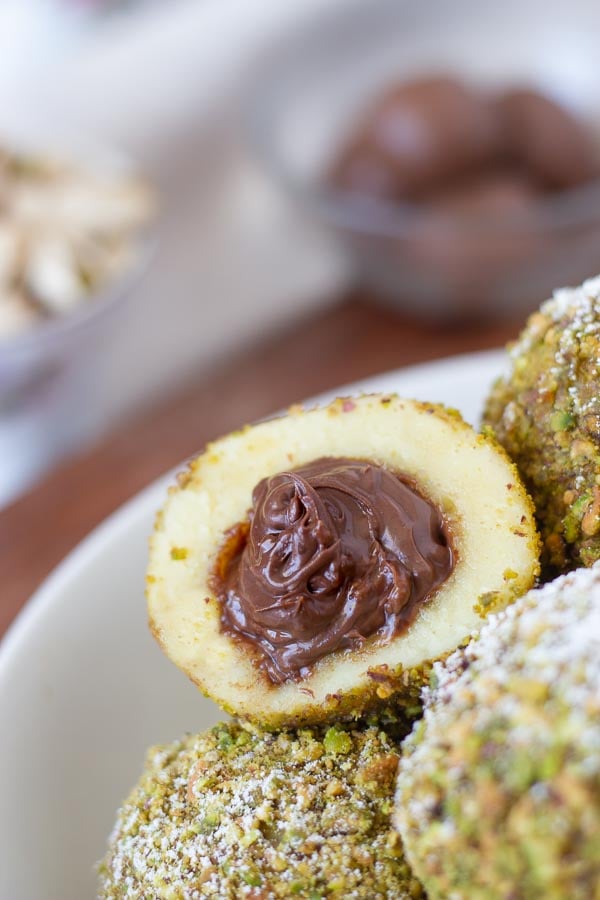 traditional German sweet semolina dumpling filled with hazelnut chocolate and coated with ground pistachios