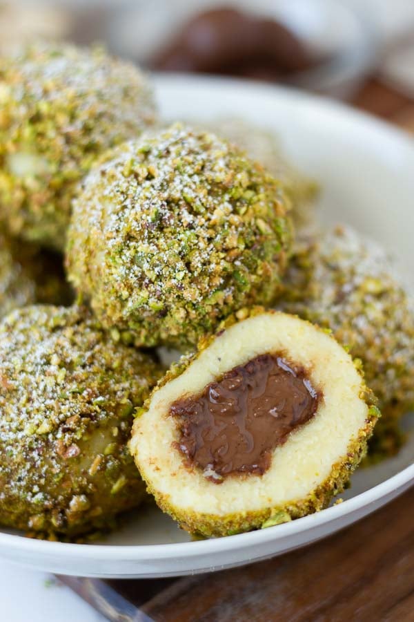 Sweet Semolina Dumplings cut into half to reveal melted Nutella chocolate center 