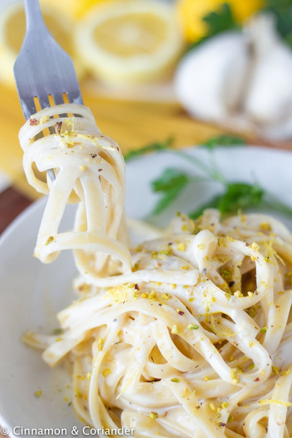 a forkful of Italian lemon cream pasta al limone