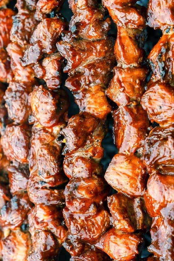 Asian glazed paleo pork skewers being grilled 