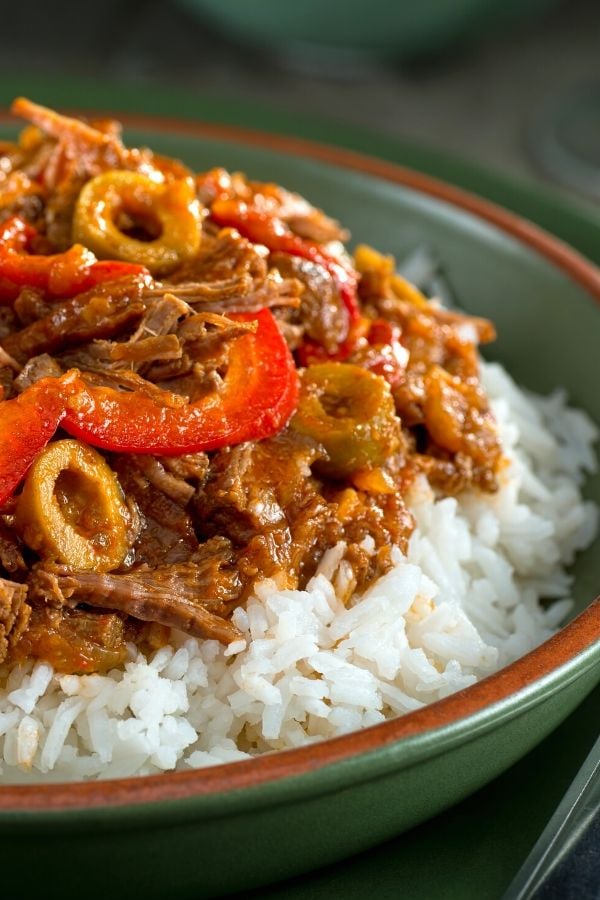 a serving of authentic Cuban Instant Pot Ropa Vieja served on rice
