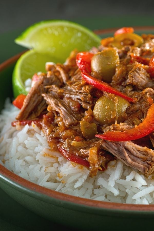 side view of a bowl with rice and Cuban Pulled Beef Ropa Vieja 