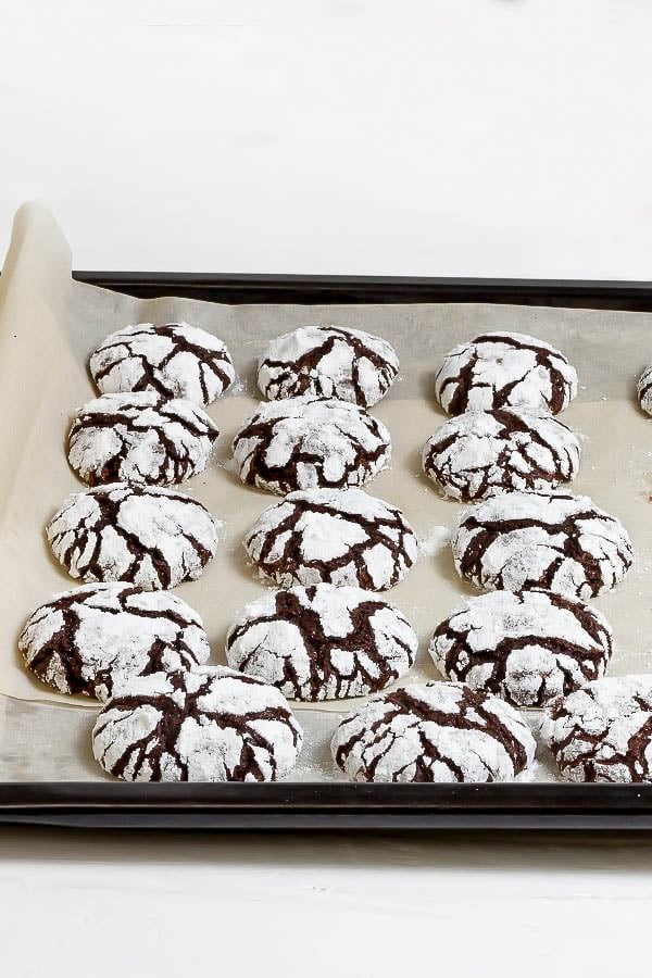 vegan chocolate crinkle cookies on a baking sheet