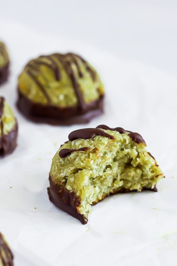 a soft and chewy pistachio coconut macaroons dipped into dark chocolate