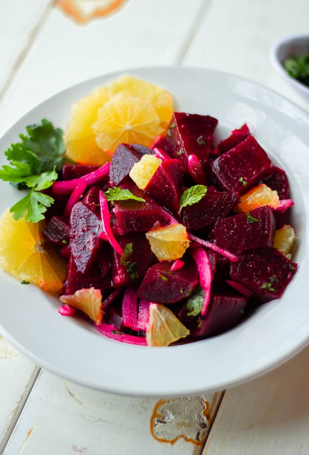 vegan beet salad with fresh orange and mint leaves
