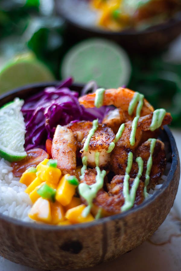 close-up of healthy Mexican shrimp taco bowl with cilantro mayo