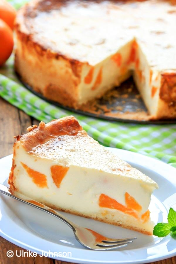 a slice of authentic German cheesecake with mandarin oranges