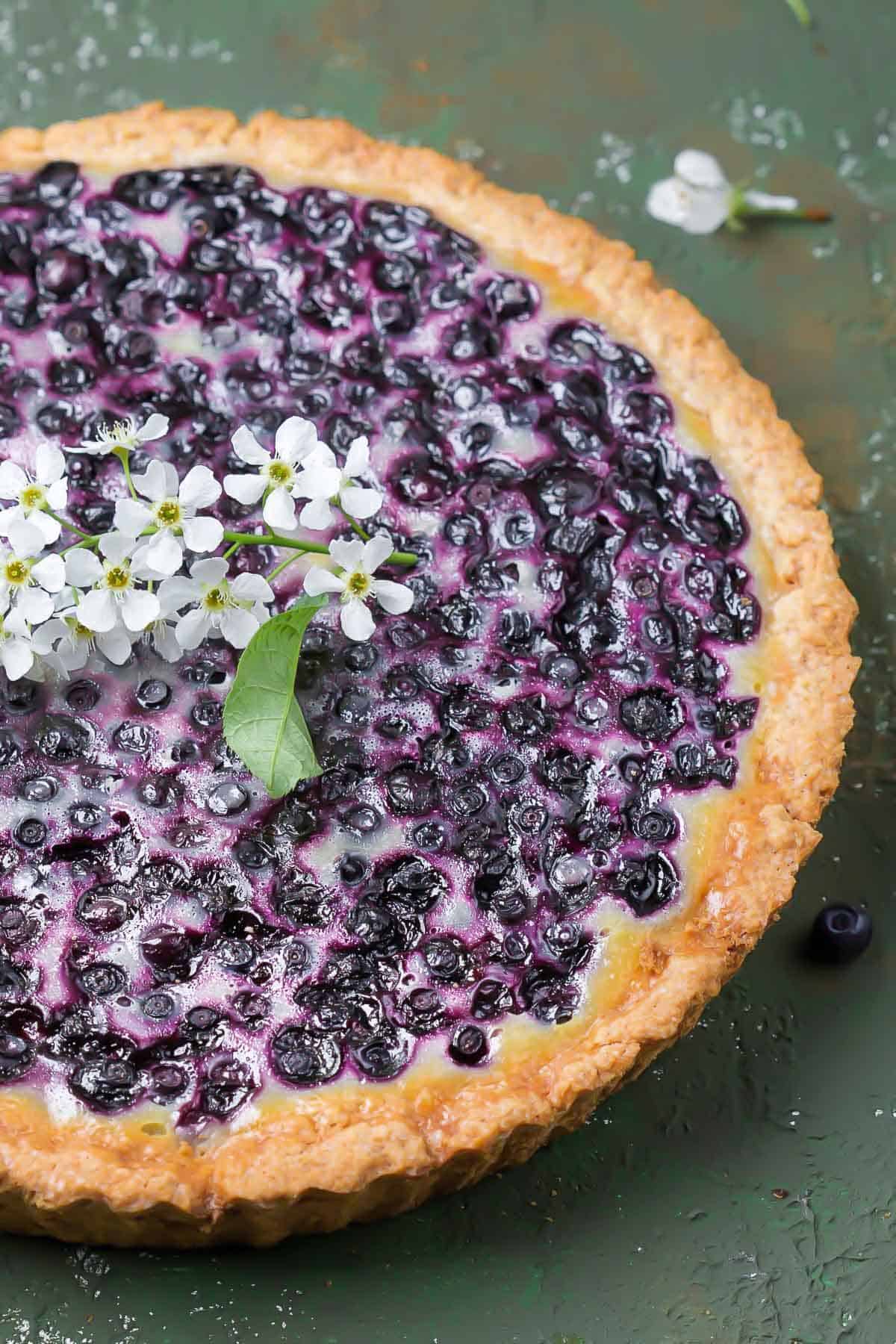 side view of a traditional Finnish Blueberry tart with sour cream and wild blueberry filling