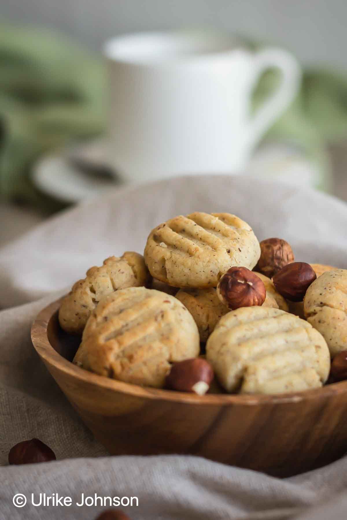 German Hazelnut Cookies made from hazelnut flour in a wooden bowl 