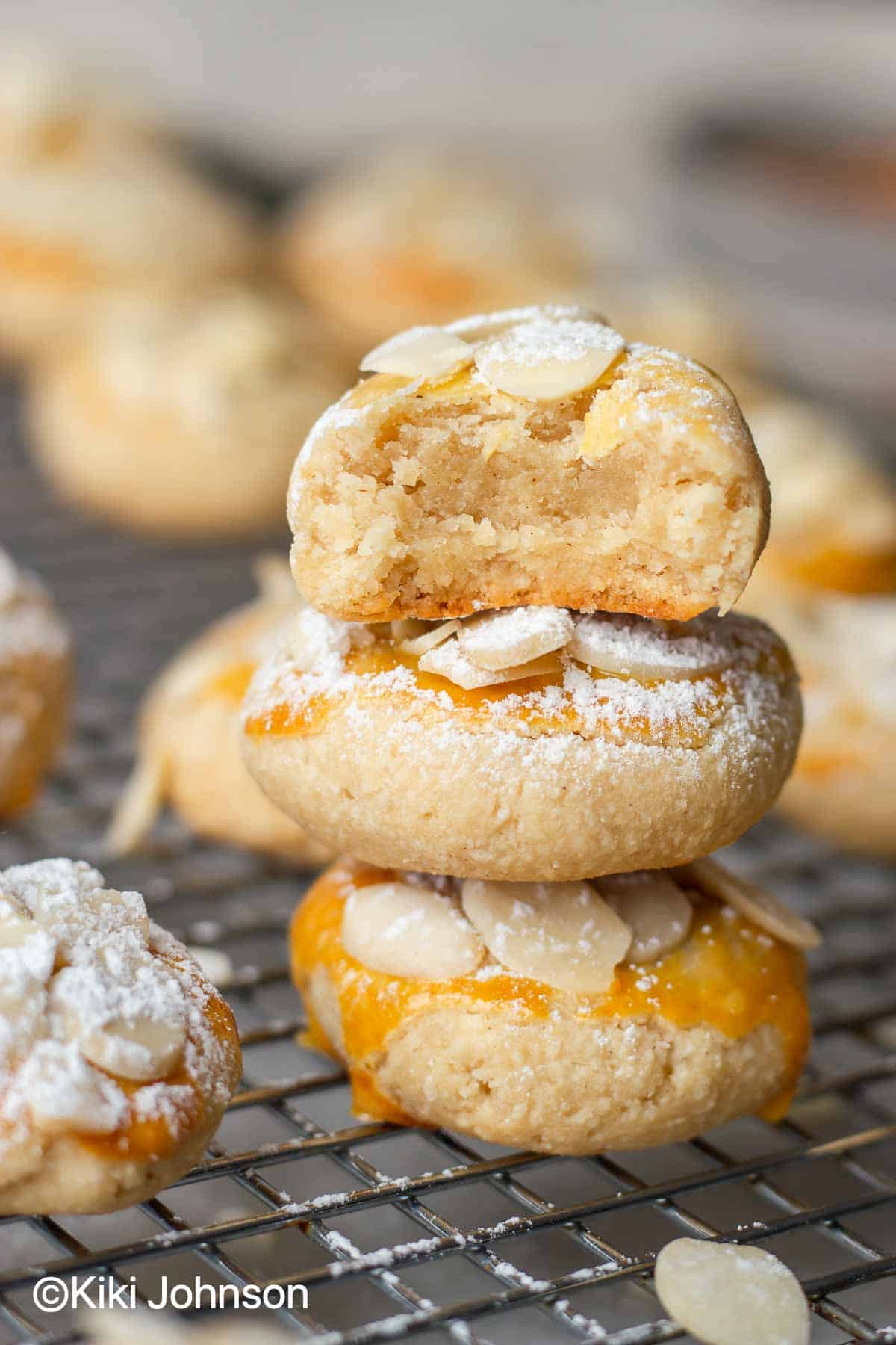 German soft almond paste cookies stacked on a cooling rack