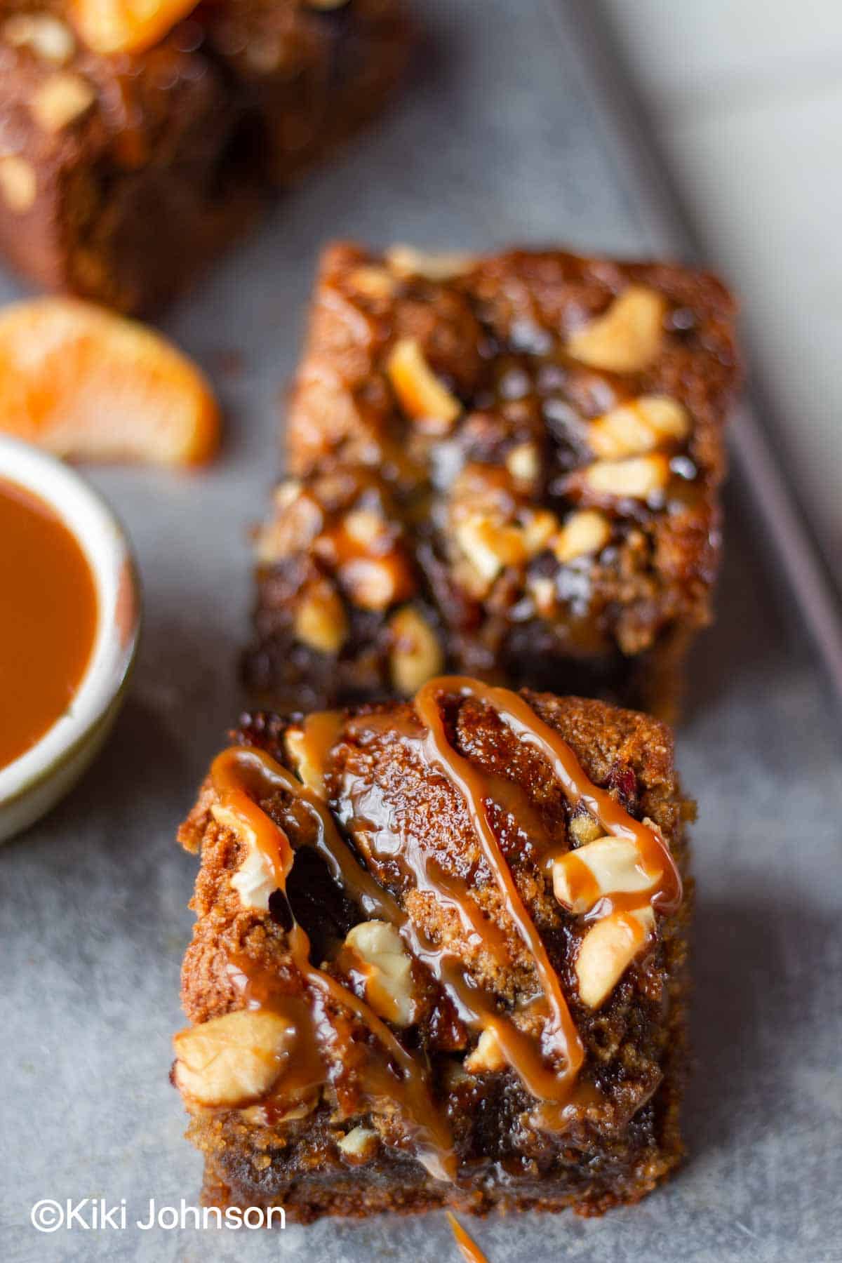healthy glutenfree and paleo salted caramel blondies with dates and nuts drizzled with coconut caramel sauce