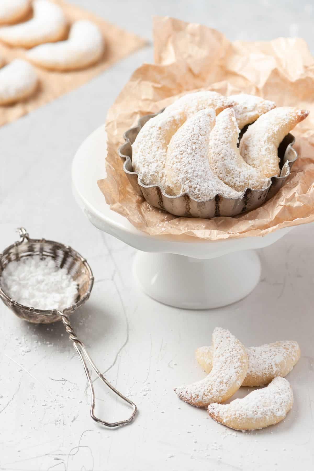 Austrian Vanilla crescent cookies on a cake stand