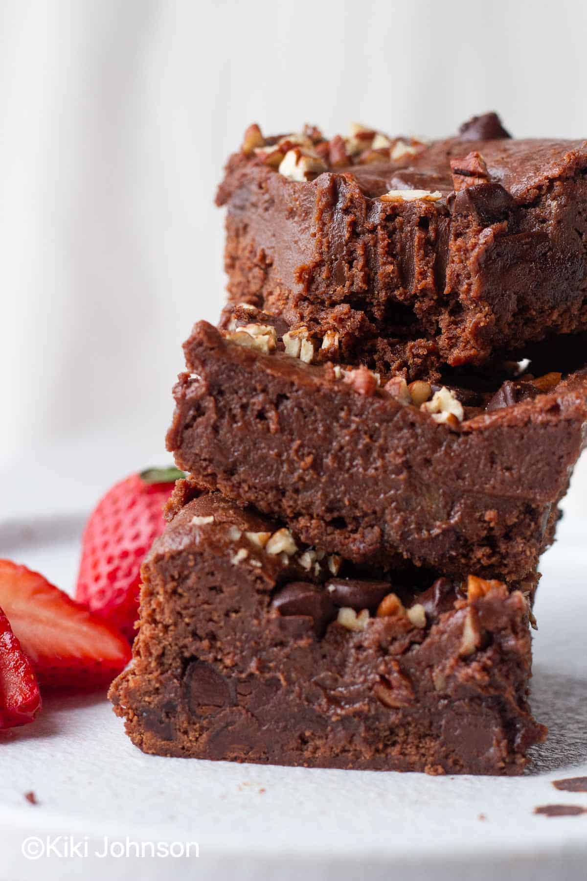 a stack of eggless nutella brownies on a plate