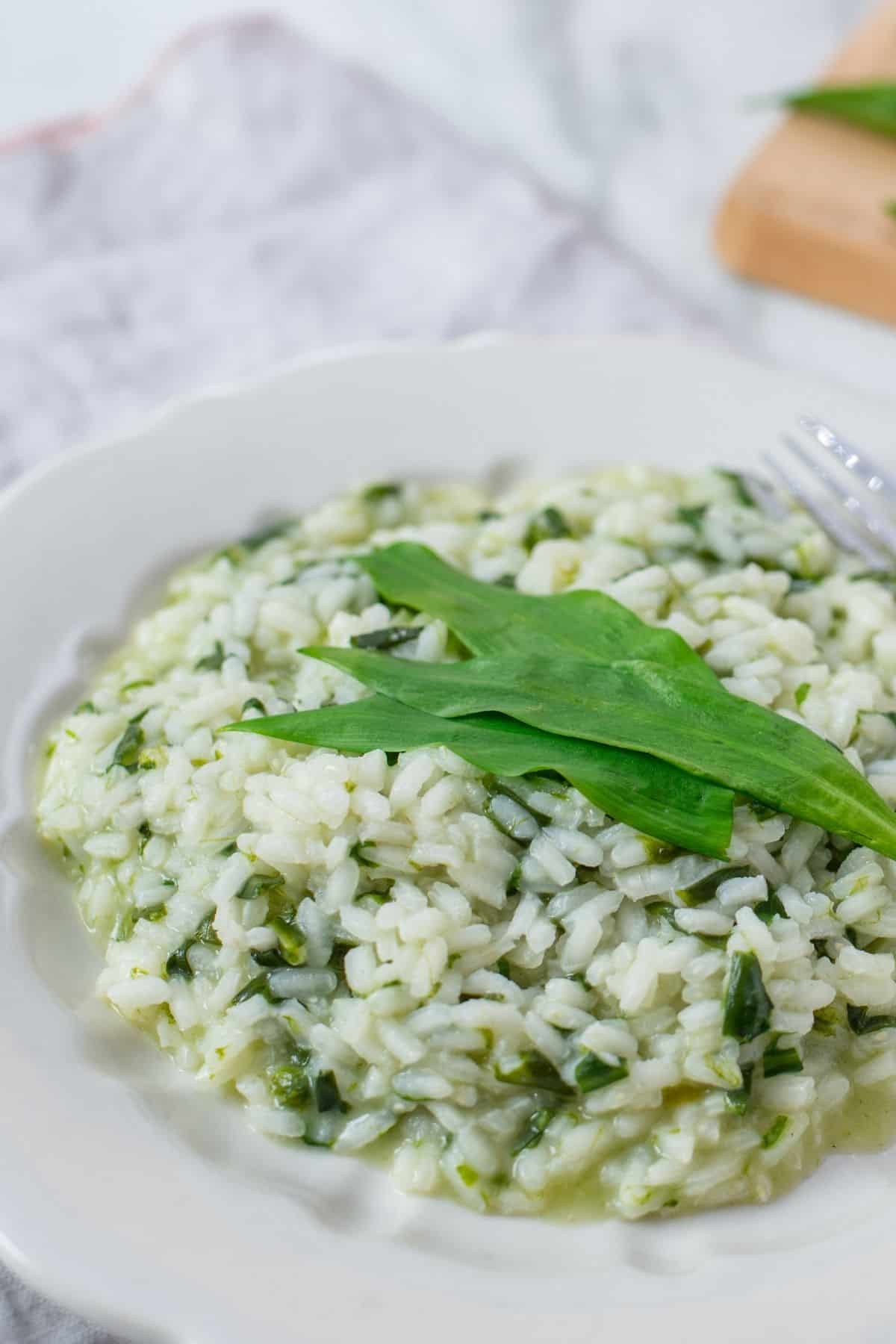 a plate with Wild Garlic Risotto made with fresh wild garlic leaves