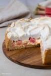 German Rhubarb Sour Cream Custard Pie with Meringue Topping on a cake platter