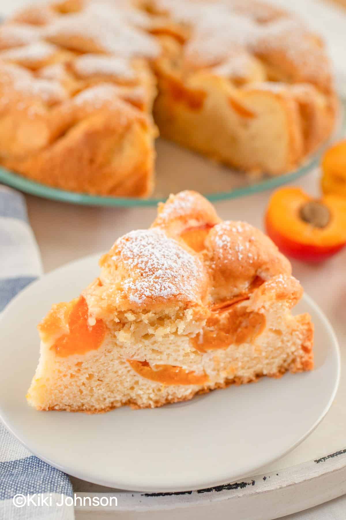 a slice of authentic Austrian vegan Apricot cake on a small cake plate