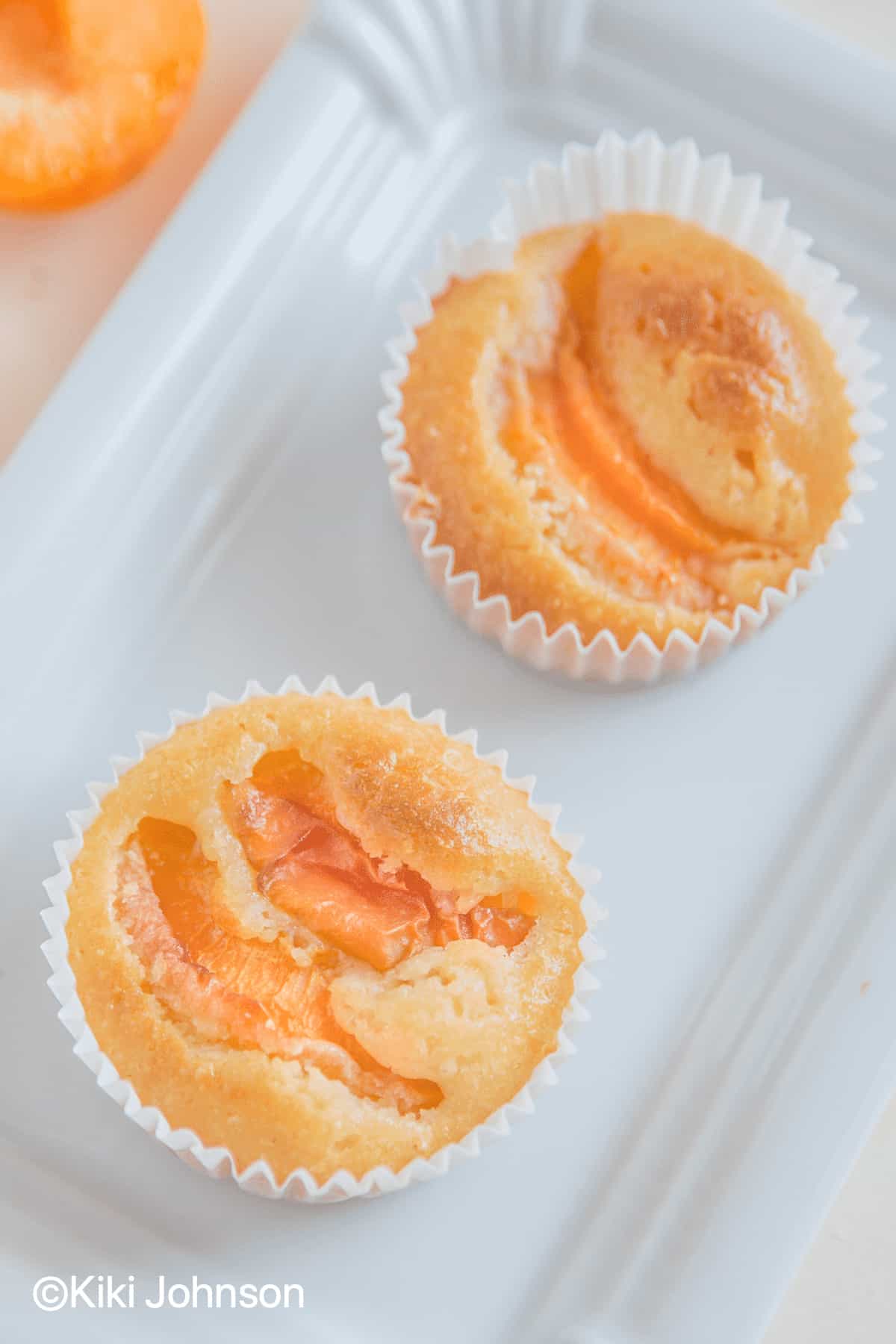 fresh apricote muffins on a paper plate