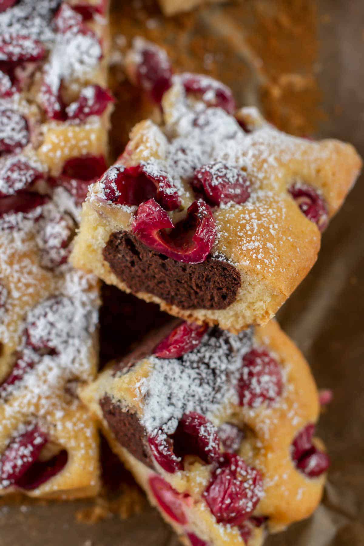 pieces of German Marble Cake baked on a sheet pan stacked on a piece of parchment paper