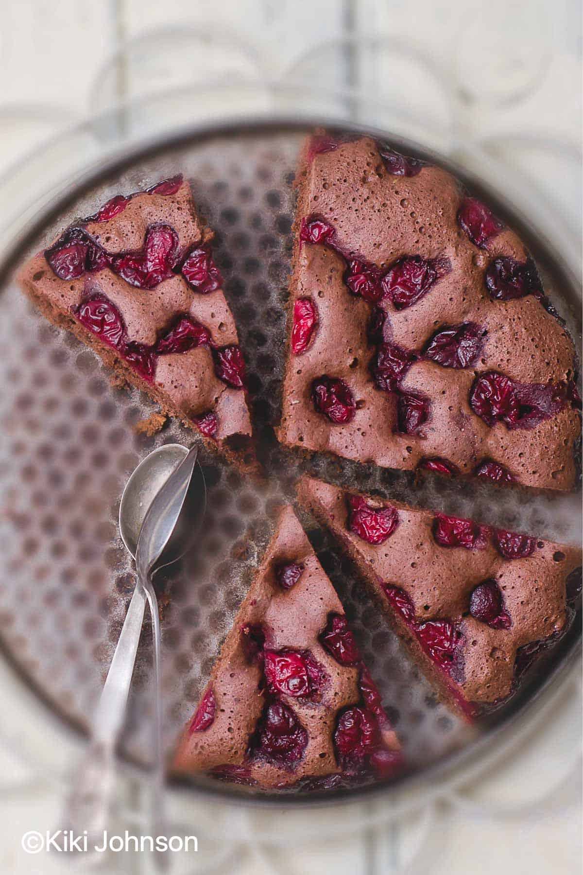 overhead shot of vegan cherry chocolate cake in a springform pan 