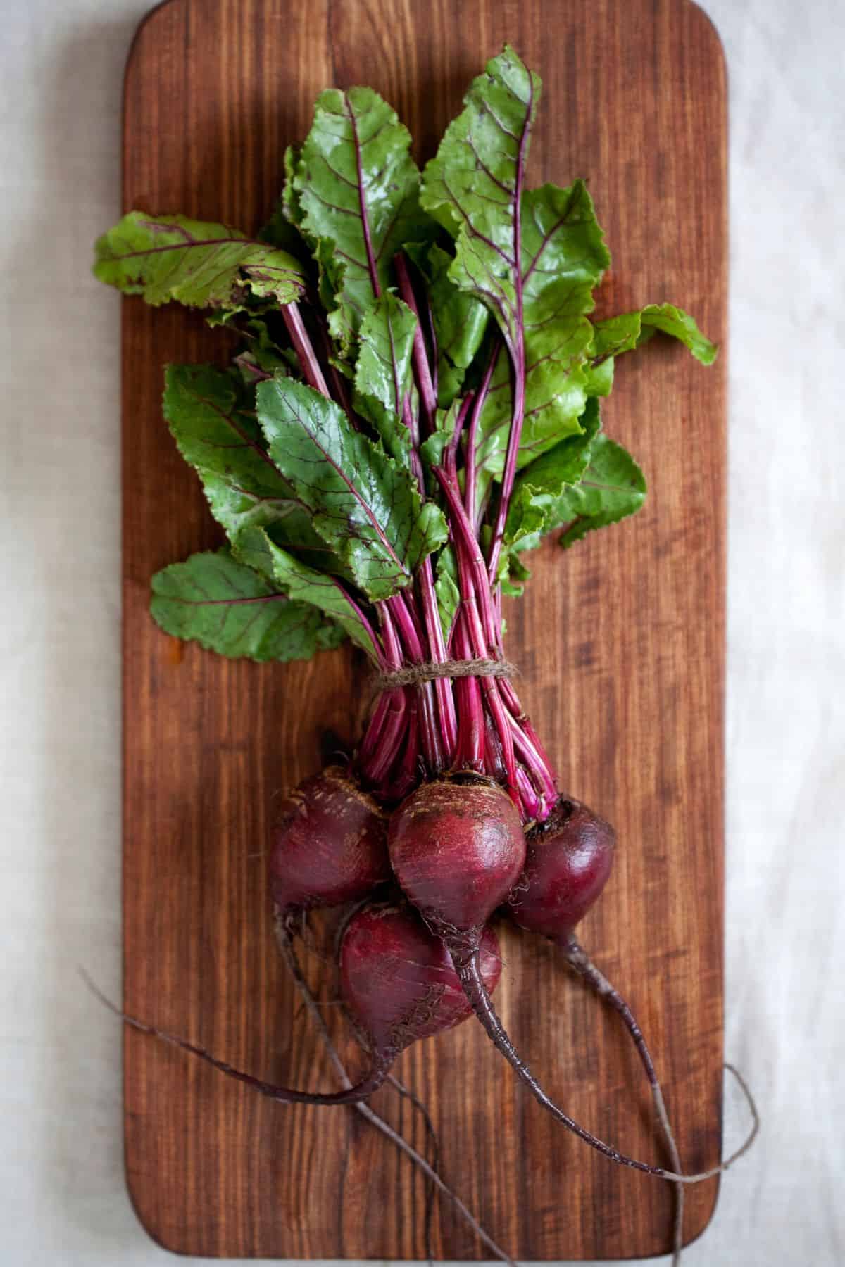 fresh beets on a wooden board 