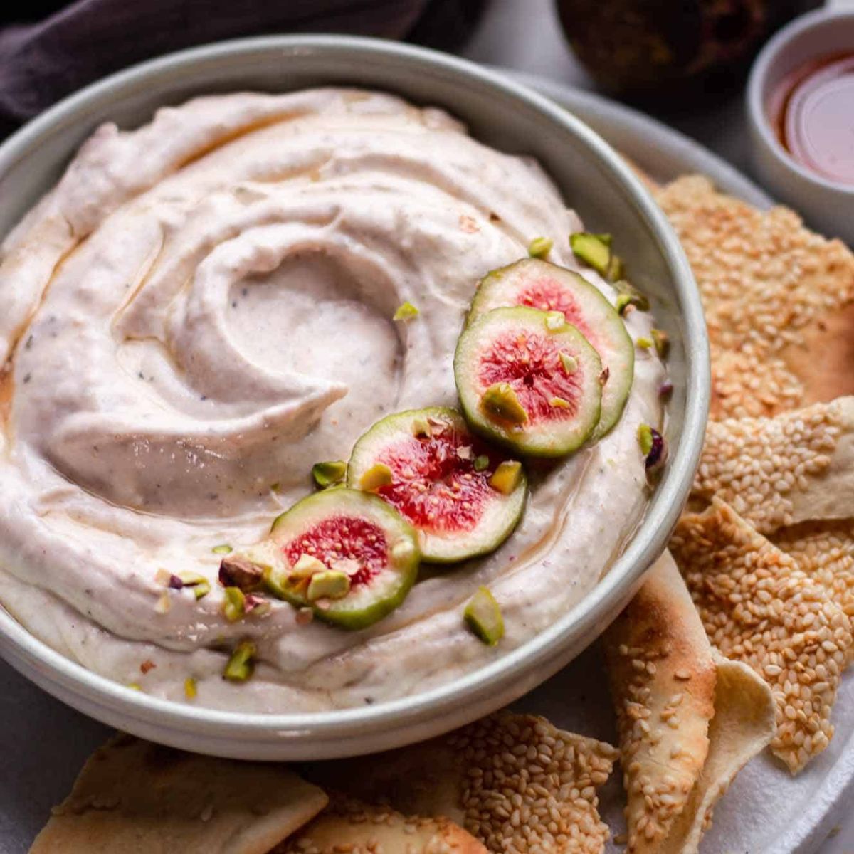 fig spread topped with fresh fig slices and honey