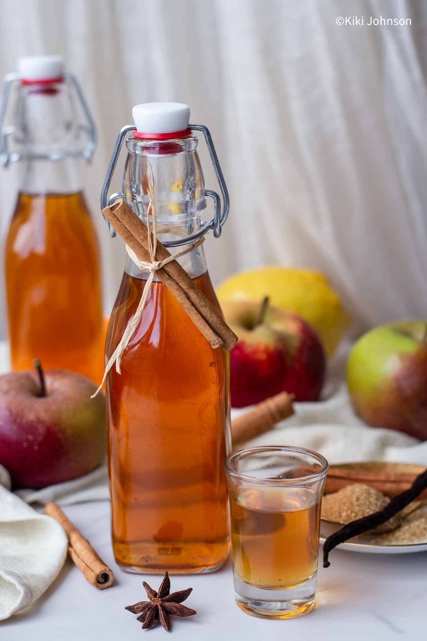 a bottle of homemade apple liqueur. 