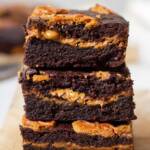 Stacked Lotus Biscoff Brownies with crushed Cookies and filled with lotus biscoff spread swirls