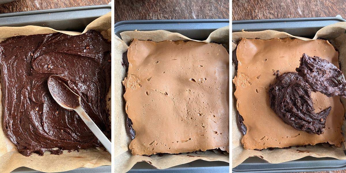 brownie batter being layered with biscoff cookie butter in a brownie pan.