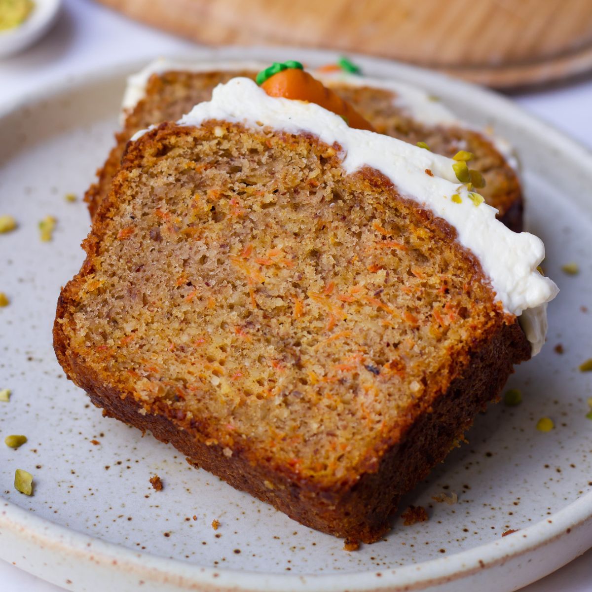 two slices of German Carrot Cake with Lemon Cream Cheese Frosting