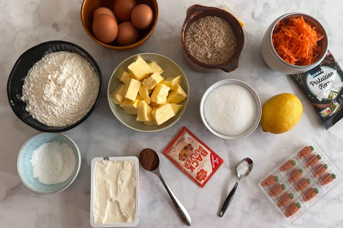 ingredients for Swiss German carrot cake on a marble surface