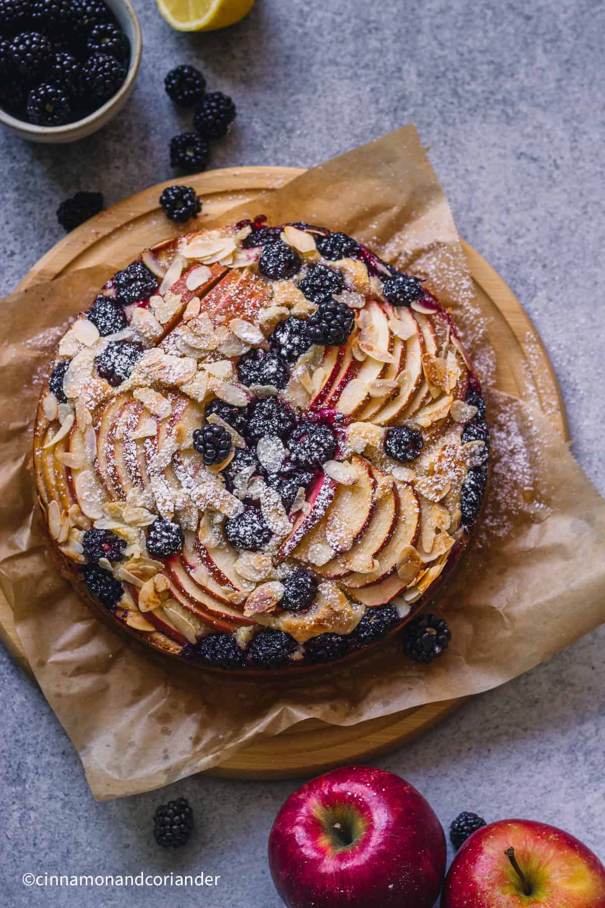 overhead shot of a  Apple Blackberry Cake on a piece of parchment paper